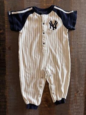 New York Yankees baseball-style romper featuring pinstripes and team logo